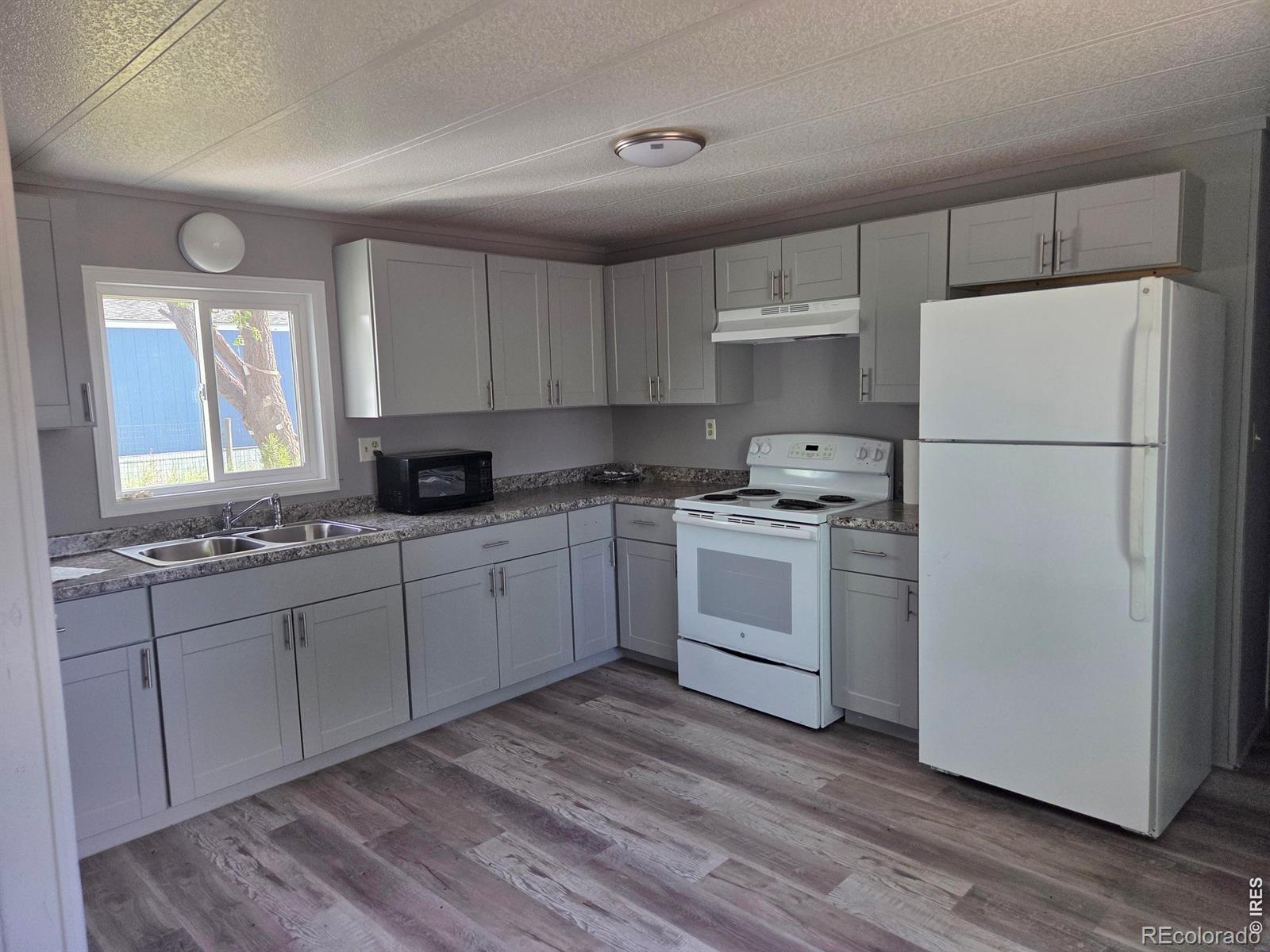 101 Larch Drive Log Lane Village CO 80705