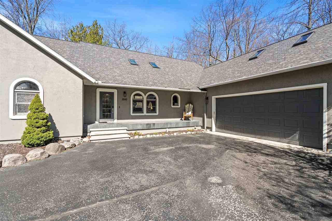 9045 North Pointe Woods Drive Charlevoix MI 48720